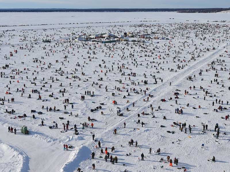 Overhead view of people ice fishing