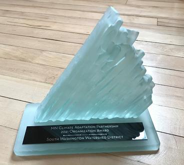 Picture of the Award, a piece of glass art shaped like an iceberg